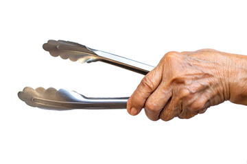 Senior woman's left hand holding Stainless tongs for cooking on white background, Close up shot, Selective focus, Kitchen utensils concept