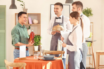 Wall Mural - Young people attending professional waiter courses