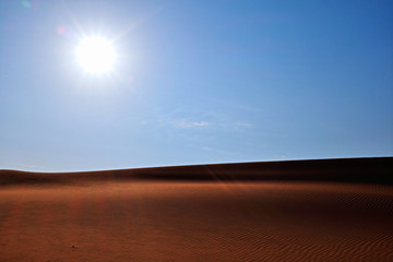 Wall Mural - Bright sun, clear blue sky and rippled desert sand. Arabian Desert, Riyadh, Saudi Arabia