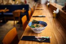 Delicious Hot Warming Japanese Ramen Noodles Soup In A Traditional Blue Bowl On The Table, Horizontal