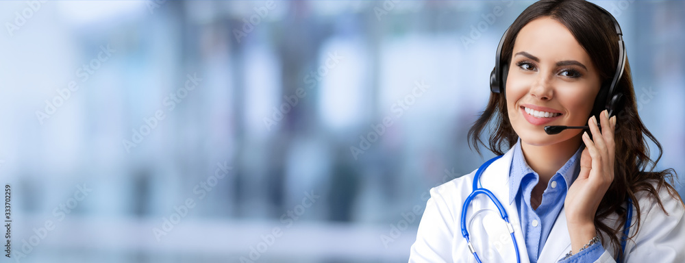 Portrait of happy smiling young female doctor in photo headset, over blurred office background, with blank copy space area for some slogan or text. Medical call center concept picture. - obrazy, fototapety, plakaty 