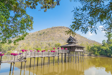 Wall Mural - The wooden Tripitaka Library (Ho Trai)  Nakhon Ratchasima