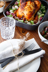 Wall Mural - Black styled cutlery decorated with dried grass on a linen. The concept of celebrate event or Thanksgiving dinner.