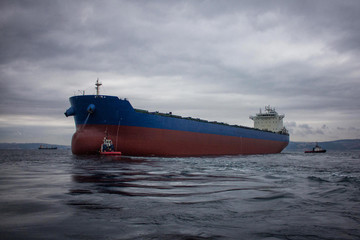 launching of renovated tanker cargo ship from dock to water.