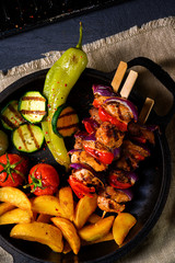 Wall Mural - Shish kebab with various vegetables and spice country potatoes