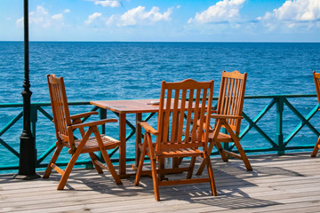 table and chairs on the beach seafront