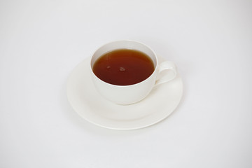 white cup with tea on a white background