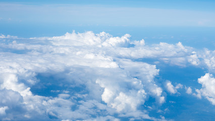 Cloudy sky against a blue background.