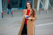 © ostap_davydiak - girl holds a passport near the airport