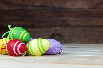 Wall Mural - Easter eggs lay on a wooden surface, background, copy spaсe	