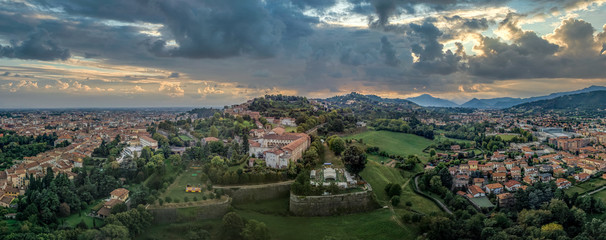 Wall Mural - Stormy clouds brewing over the medieval walled city center of Bergamo, Lombardy Italy with views of the Venetian angled bastions