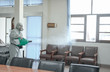 © grooveriderz - Disinfecting of office to prevent COVID-19, person in white hazmat suit with disinfect in office, coronavirus concept