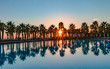 © Dieter Meyer - Sonnenuntergang am Pool mit Palmen in Salgados in Portugal