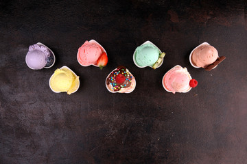 Wall Mural - Various of ice cream flavor whit fresh blueberry, strawberry, kiwi, lemon, vanilla setup on rustic background . Summer and Sweet cold ice cream