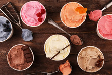 Various Of Ice Cream Flavor With Fresh Blueberry, Strawberry, Almond, Chocolate, Vanilla Setup On Rustic Background . Summer And Sweet Cold Ice Cream