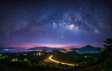 Wall Mural - milky way galaxy in the sky from a high mountain view point. long exposure photograph, with grain.im