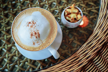 Hot cappuccino coffee in white cup