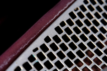 Abstract macro photography. Close up square grid pattern of steel material