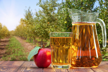 Wall Mural - apple juice in glass and jug