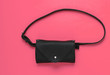 © splitov27 - Stylish belt bag on pink background. Top view