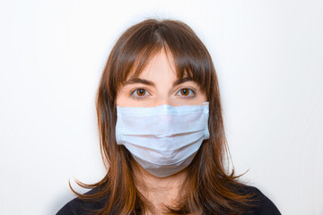 A young girl wearing a protection mask 