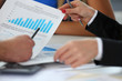 © H_Ko - Group of people hold in arms financial papers solve and discuss problem closeup. Fresh view review situation new angle look professional training white collar investment and finance concept