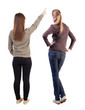© ghoststone - Back view of two pointing girl in sweater.
