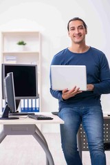 Young male it specialist working in the office
