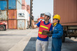 © Nopphon - Foreman and dock worker staff working checking at Container cargo harbor holding clipboard. Business Logistics import export shipping concept.
