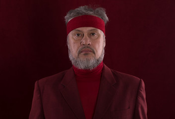 Canvas Print - Studio shot closeup portrait of a bearded man in red