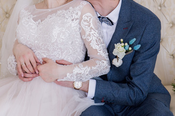 Poster - the bride and groom sit together in a chair