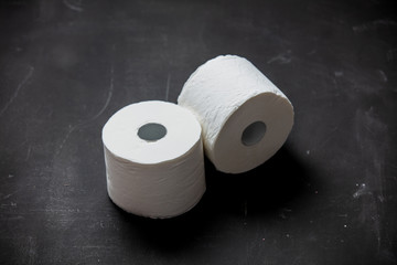 White toilet paper on dark background