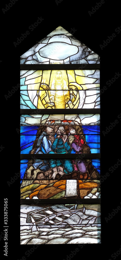 God begins salvation in this world through His Son Jesus Christ, stained glass window by Sieger Koder in St. John church in Piflas, Germany
