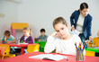 © JackF - Upset schoolgirl sitting at a desk in classroom elementary school
