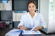 © tuiphotoengineer - Beautiful Asian business women checking document and using notebook for working at home