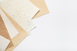 © TanyaJoy - Stack of different handmade paper on a white background
