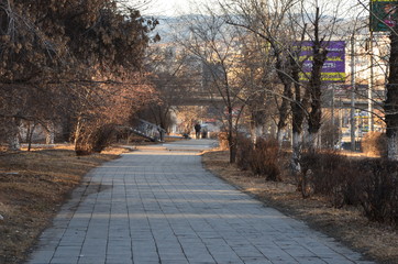 A pavement sidewalk zoomed with two men