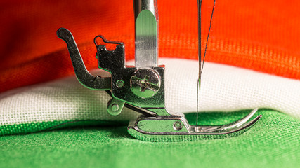 Detail of the leg of a sewing machine, with tricolor cloth of the Italian flag