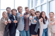 © ASDF - group of happy young business people pointing at you