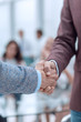 © ASDF - close up. handshake of business men on the office background