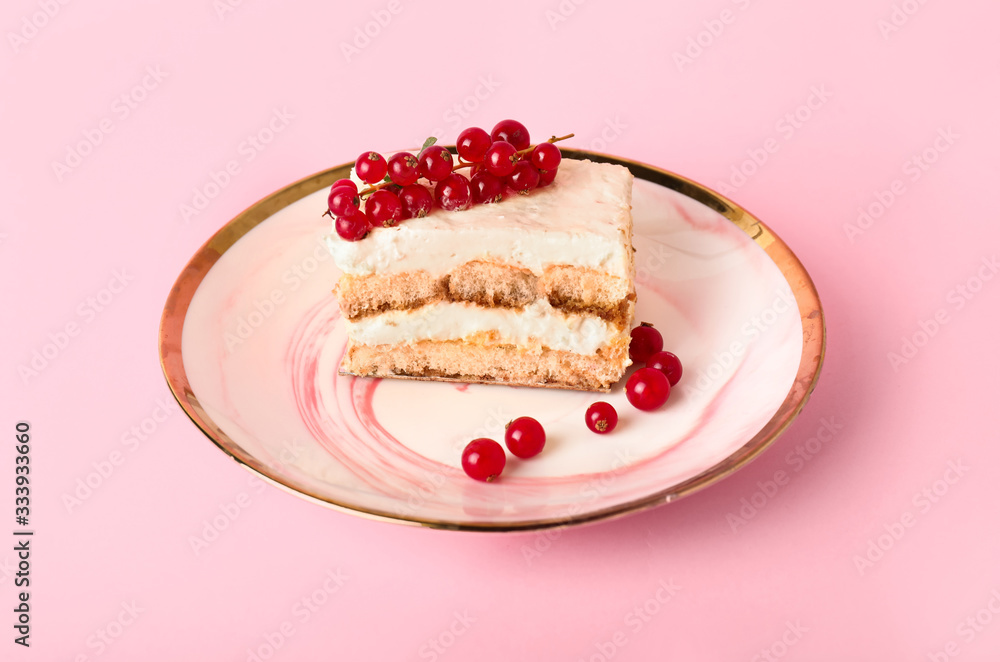 Plate with tasty tiramisu on color background