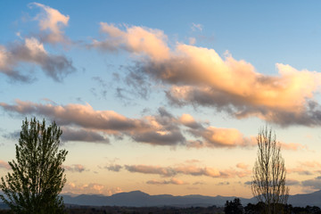 Wall Mural - Golden clouds in the sky at sunset time. Basque Country of France. 