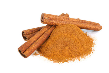 Cinnamon stick and powder isolated on white background.