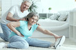 © aletia2011 - Active smiling senior couple exercising in gym