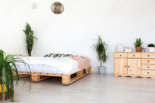 Cozy Bedroom Area At Luxury Studio Apartment With A Free Layout In A Loft Style With Big Panoramic Window And Green Plant Buy This Stock Photo And Explore Similar Images At