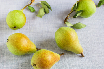 Wall Mural - pears in a plate and slices of pears top view. wooden background with pears