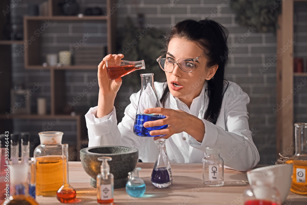 Crazy alchemist working in laboratory