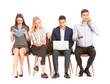 © Pixel-Shot - Young business people waiting in line on white background