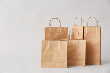  Paper shopping bags on light background