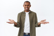 © Cookie Studio - So what. Portrait of frustrated, pissed-off and annoyed african american man complaining on awful service, spread hands sideways in dismay and irritation, squinting grimacing disappointed